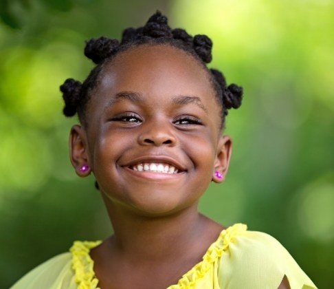Child smiling after receiving dental sealants