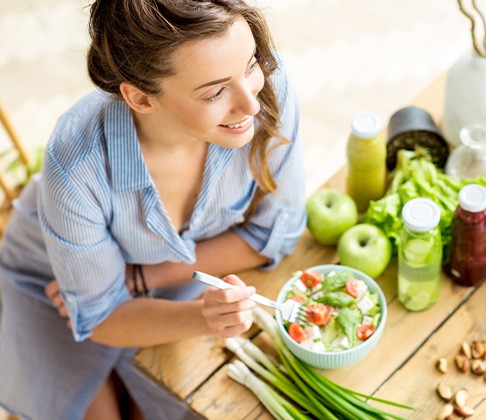 Dental implant patient in Sachse about to cook a healthy meal