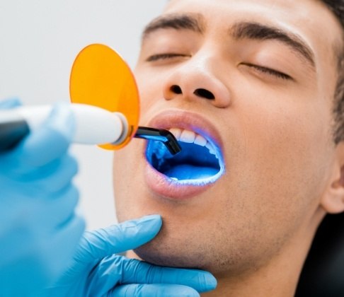 Patient receiving cosmetic dental bonding