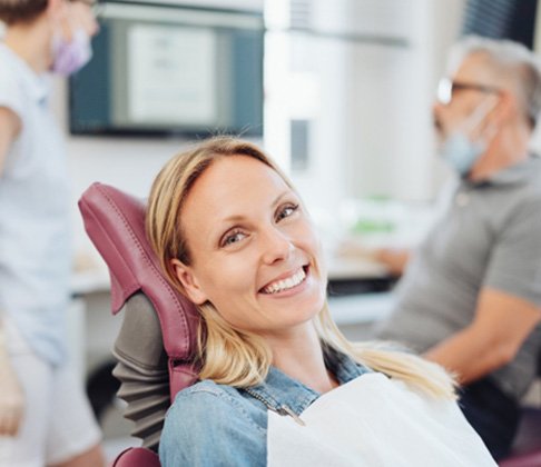 Woman smiling in the dental chair