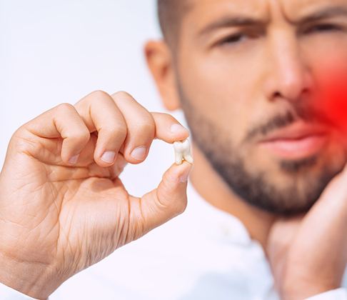 CGI illustration of a tooth being extracted with forceps 