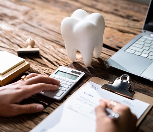 patient calculating cost of Invisalign in Sachse