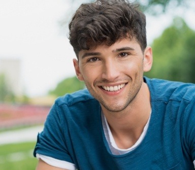 Young man with healthy smile after restorative dnetistry