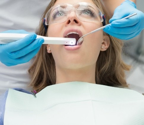 Dentist using intraoral camera to capture smile photos